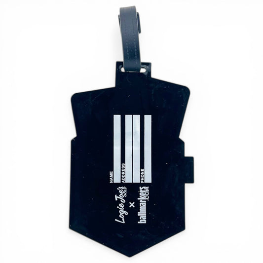 The Pocket Aces Clip-On Tag is a black multi-use bag tag with a handle, three vertical fields for name, address, and phone number, and branded with “Logic Test” and “Hallmarkeds” in white. Great as a travel or golf accessory.
