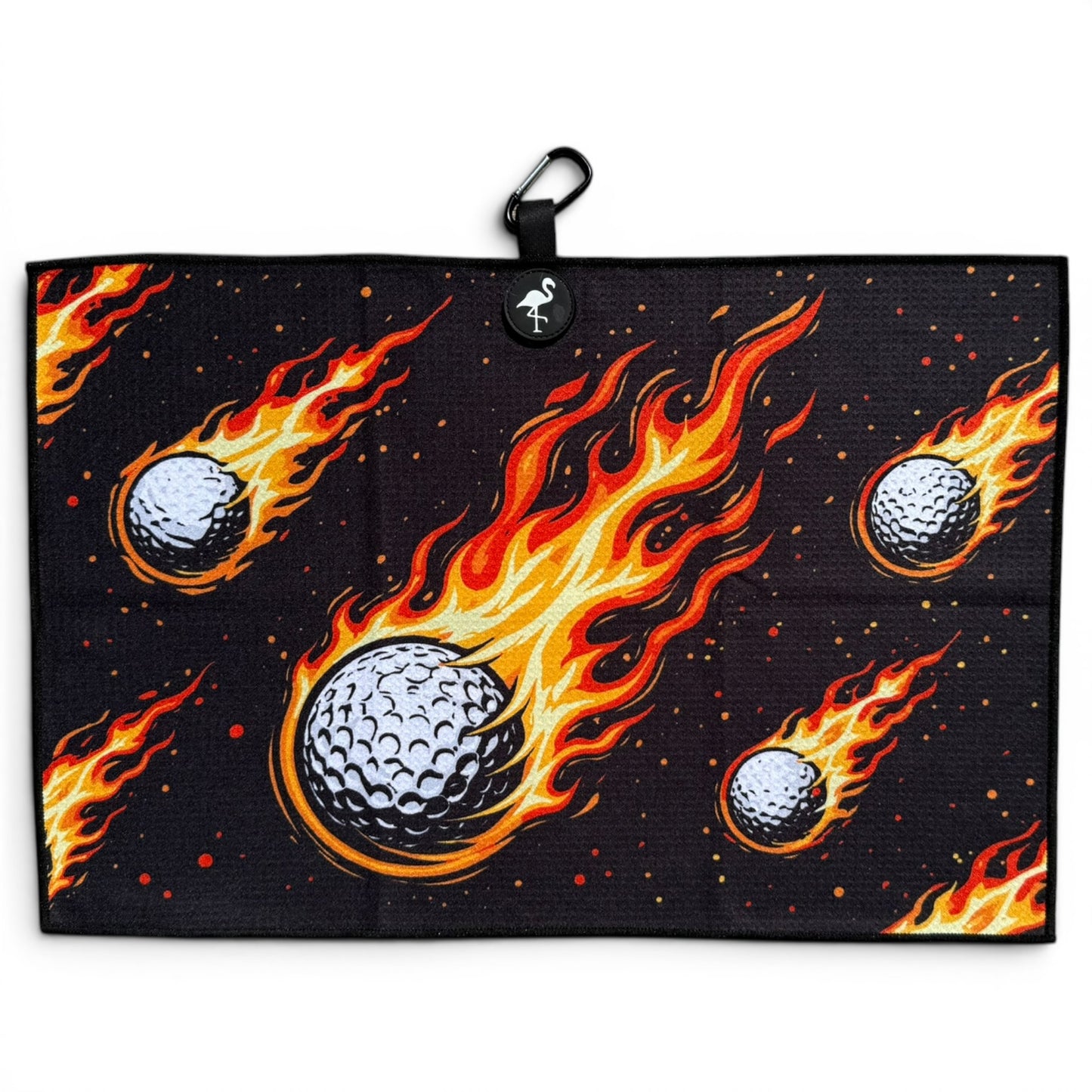 The Fireball Drive Golf Towel (24” x 16”) features black microfiber with flaming golf balls, plus a magnetic clip and carabiner for easy hanging—making it a premium, dynamic golf accessory.
