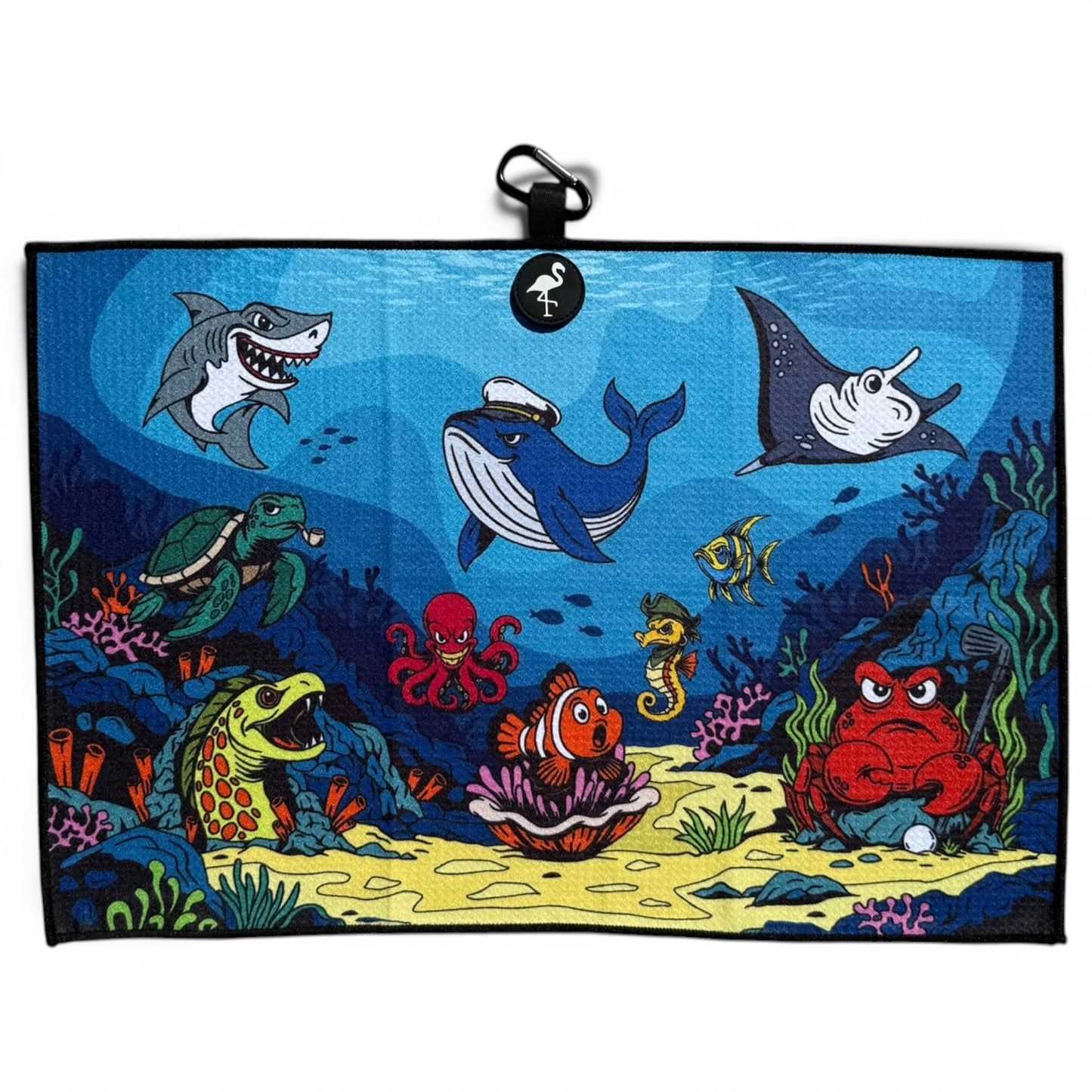 The Deep Blue Sea Golf Towel (24” x 16” microfiber) showcases playful sea animals among coral reefs and features a magnetic clip & carabiner—making it a fun, premium golf accessory.