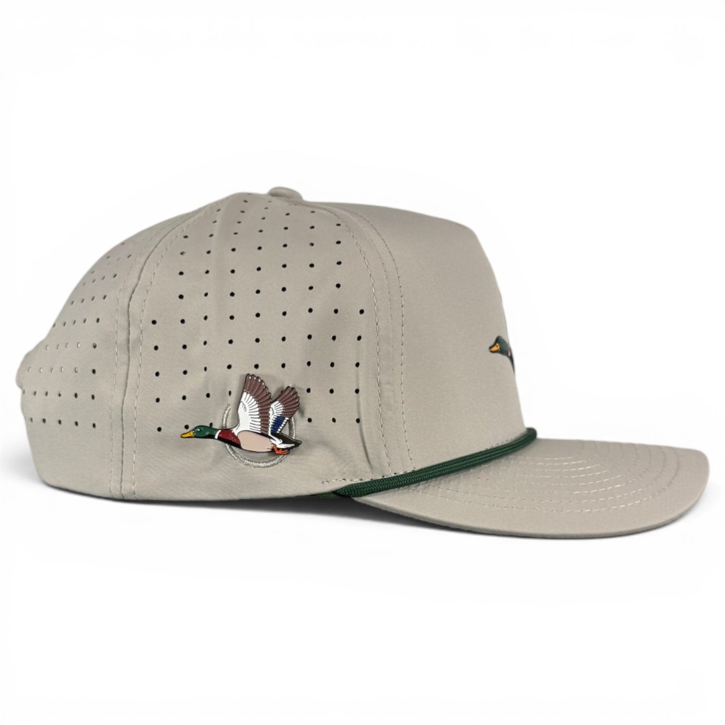Black cap with a gold safety pin detail on a white background