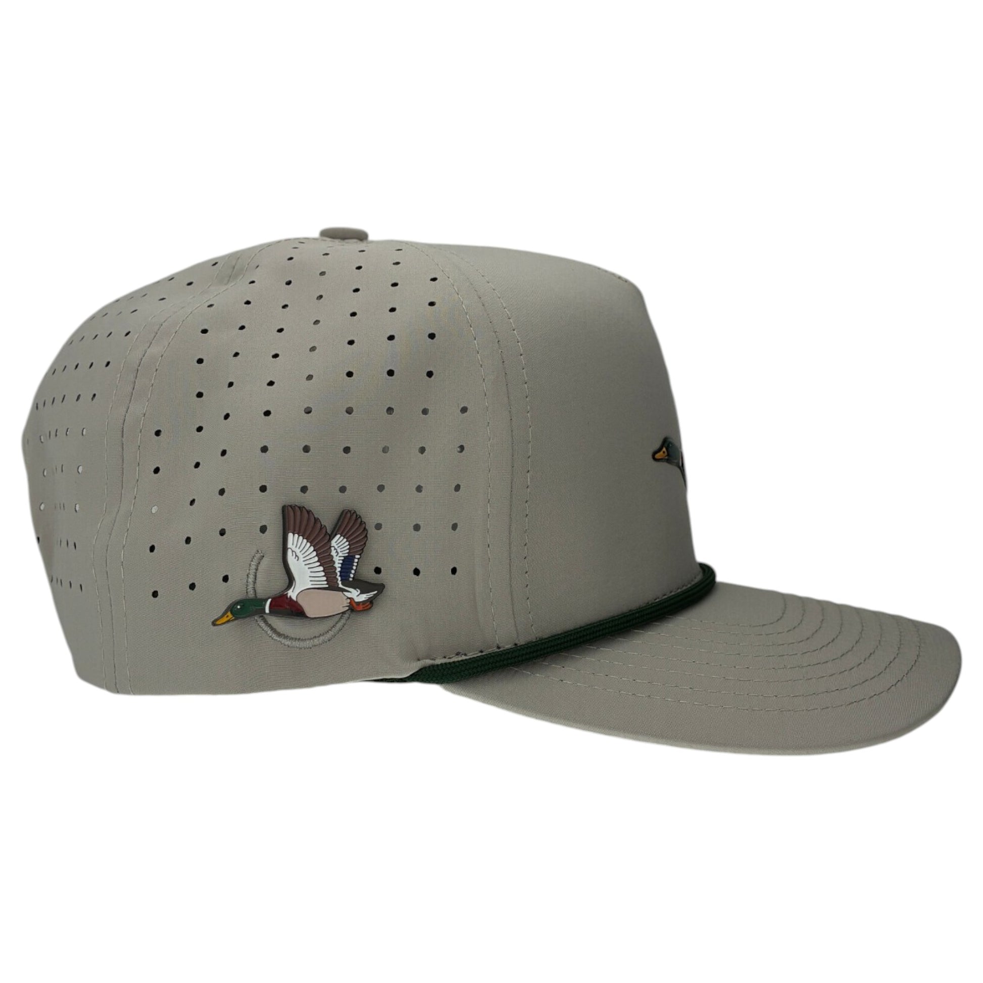 The Mallard Golf Hat is a light gray snapback cap with small ventilation holes, green brim trim, and an embroidered duck. It features an adjustable fit plus a built-in magnetic ball marker holder with marker included—perfect for your golf game.
