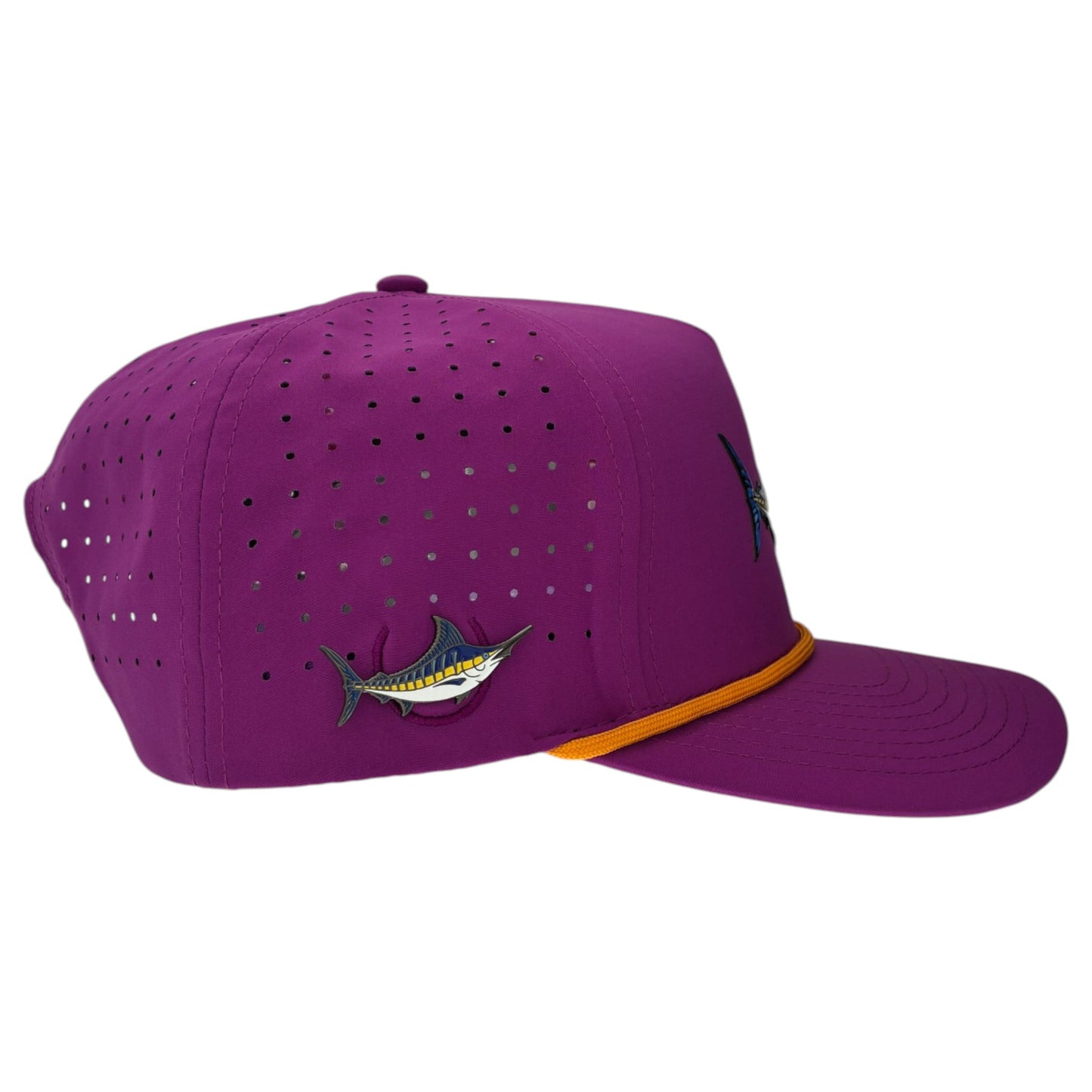 The Marlin Golf Hat is an adjustable purple snapback cap with a built-in magnetic ball marker holder (marker included), small ventilation holes, an embroidered marlin fish on the side, and a thin yellow band above the brim.