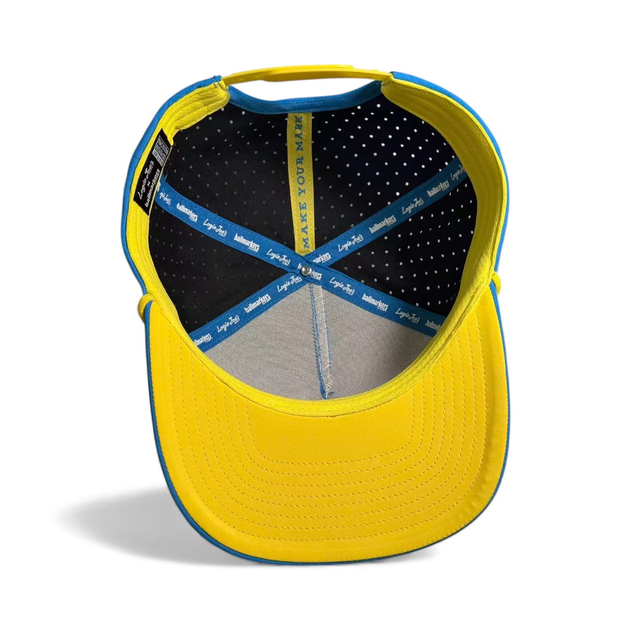 Interior view of the Tequila and Lime Golf Hat in yellow with blue trim, black perforated lining, blue and white branded bands, stitched label, and “MAKE YOUR MARK” inside. Features a built-in magnetic ball marker holder with marker included.