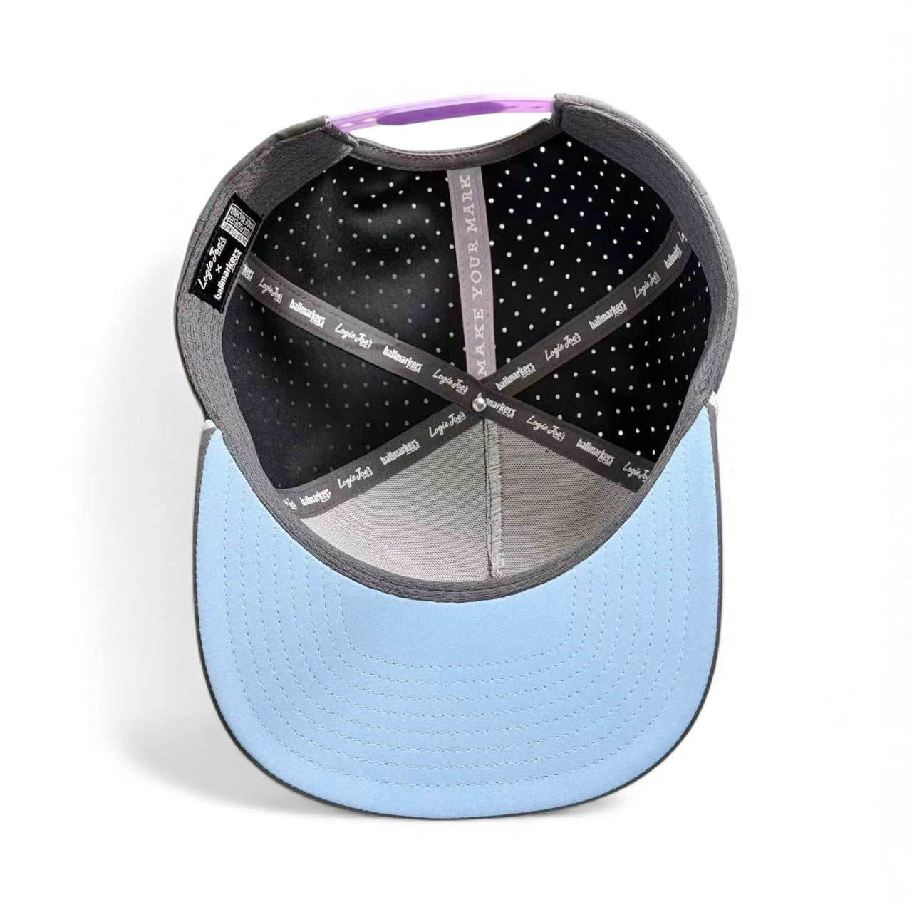 The Astronaut Walker Golf Hat is an adjustable gray snapback cap with a built-in magnetic ball marker holder and marker included—perfect for golfers or anyone seeking a stylish accessory.