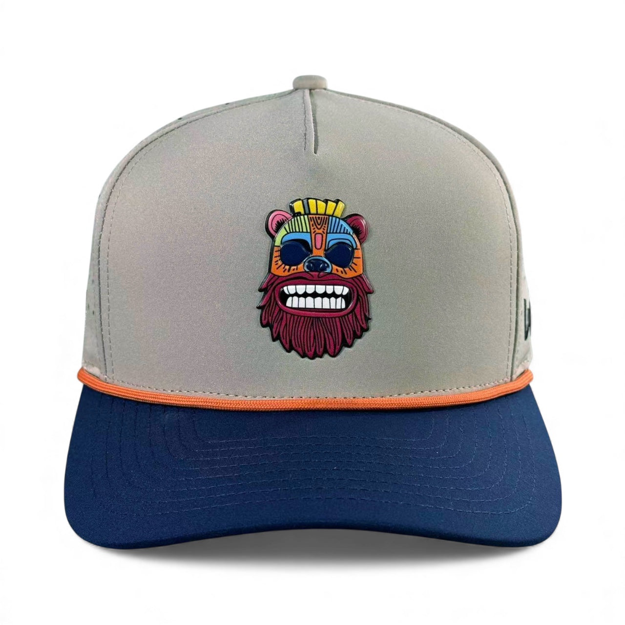 The Tiki Bear Golf Hat is a gray and navy adjustable snapback cap with a colorful embroidered bear face, orange trim, built-in magnetic ball marker holder, and includes a marker for convenience.