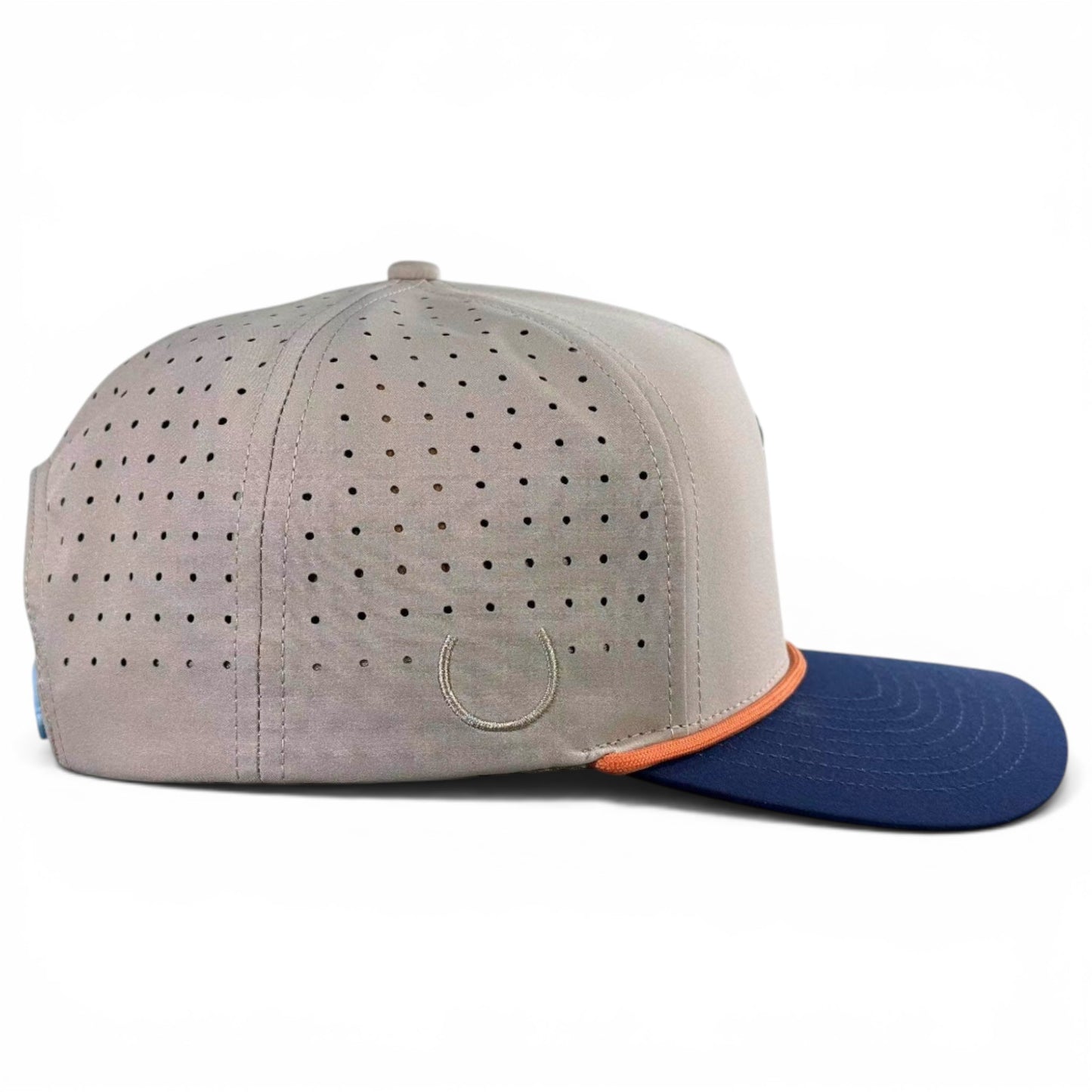 The Tiki Bear Golf Hat is a light gray, multicolor snapback cap with a blue brim, orange trim, and a built-in magnetic ball marker holder plus marker, shown from the side on a white background.