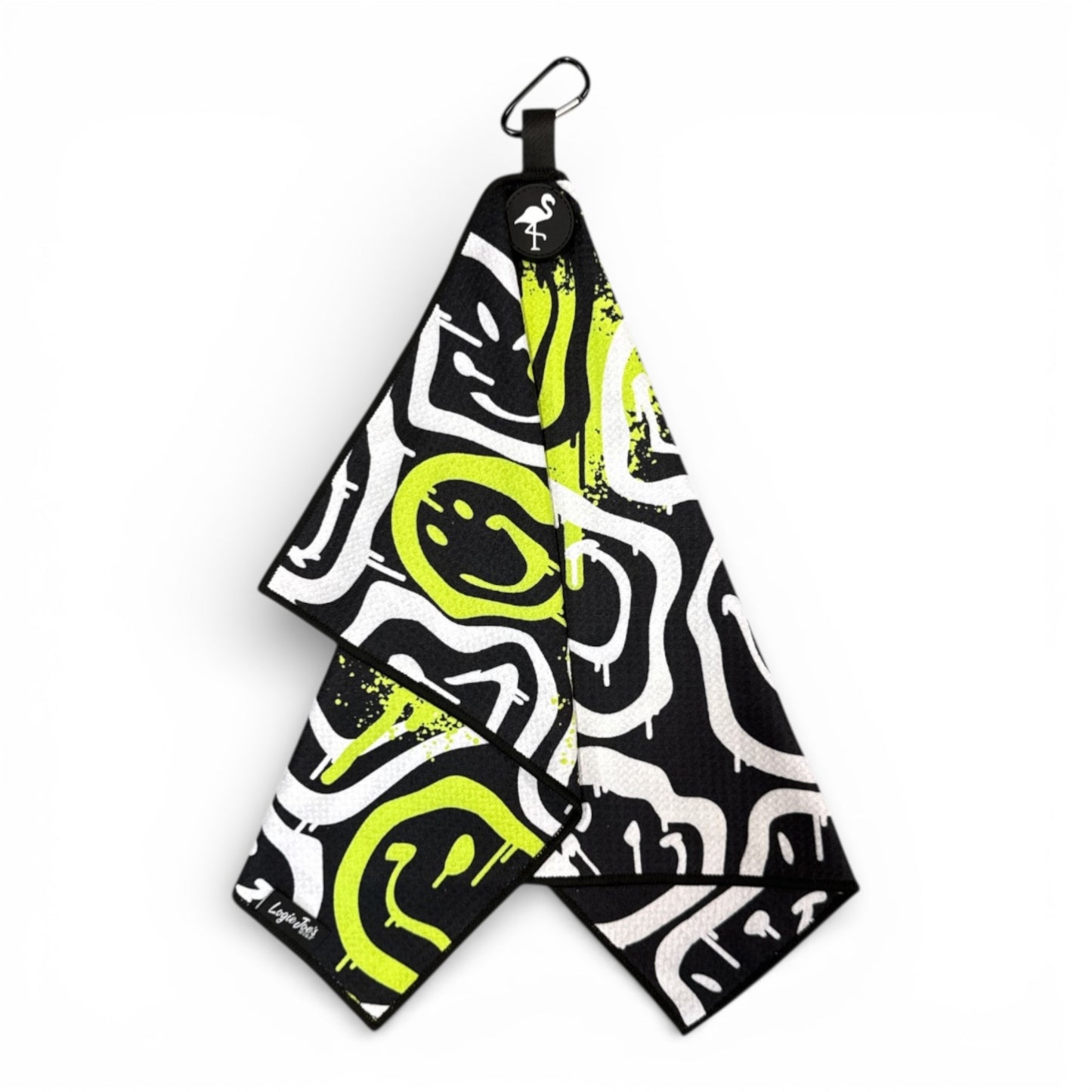 The Drippy Smile Golf Towel features black, white, and neon yellow abstract designs with graffiti-style smileys. This 24 x 16 in premium double-sided microfiber towel comes with a heavy-duty magnetic carabiner clip for easy attachment.