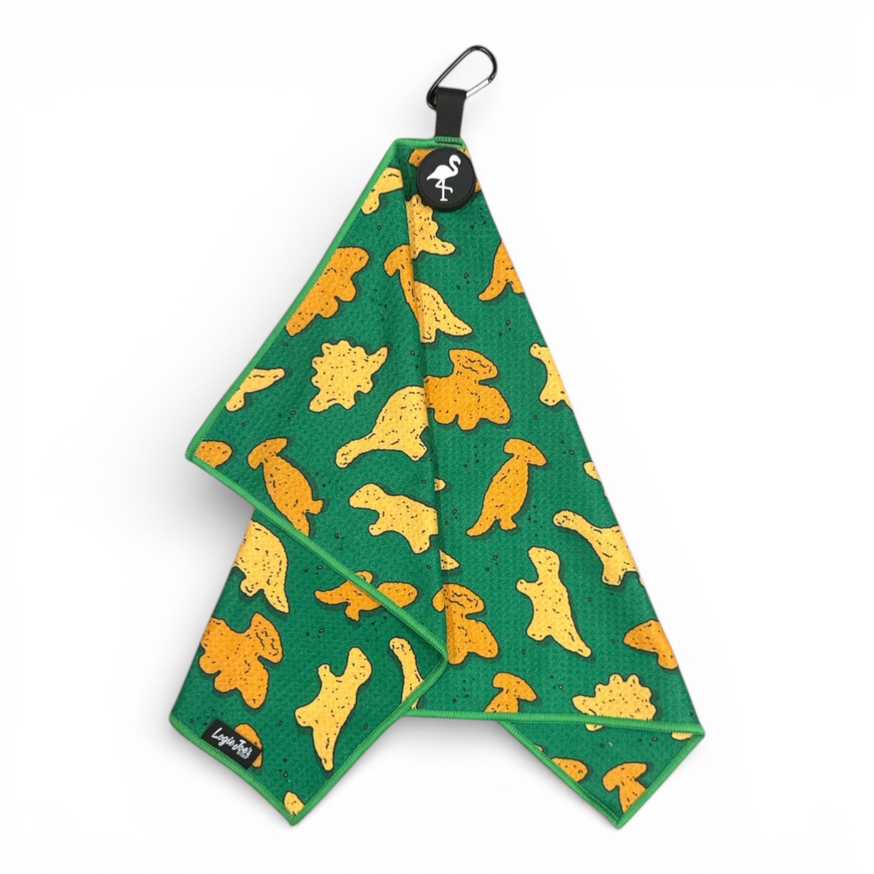 The Green Dino Nugget Golf Towel features yellow dinosaur shapes, a carabiner clip, magnetic attachment, and premium double-sided microfiber—perfect for golfers seeking a fun and functional 24 x 16 in towel for the course.