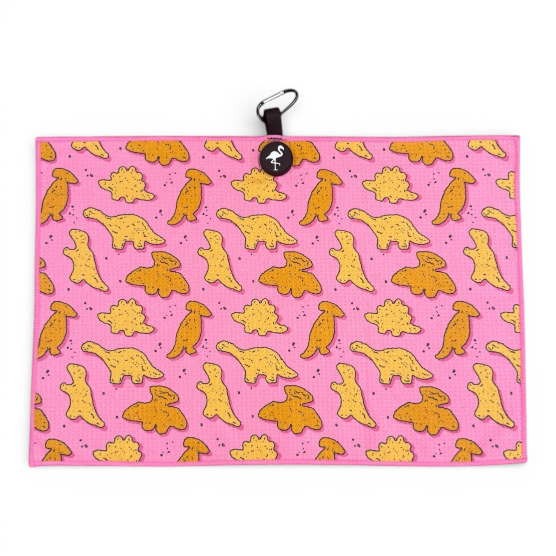 The Pink Dino Nugget Golf Towel (24x16 in) features yellow and orange cartoon dino nuggets on pink microfiber, with a heavy-duty magnetic design, carabiner clip, and round logo—an ideal gift for golfers.