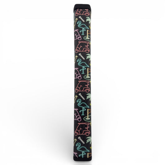The Miami Slice Putter Grip features a neon slice design with flamingos, palm trees, and golf carts on premium black PU for a soft, tacky feel. Shown upright on a white background.