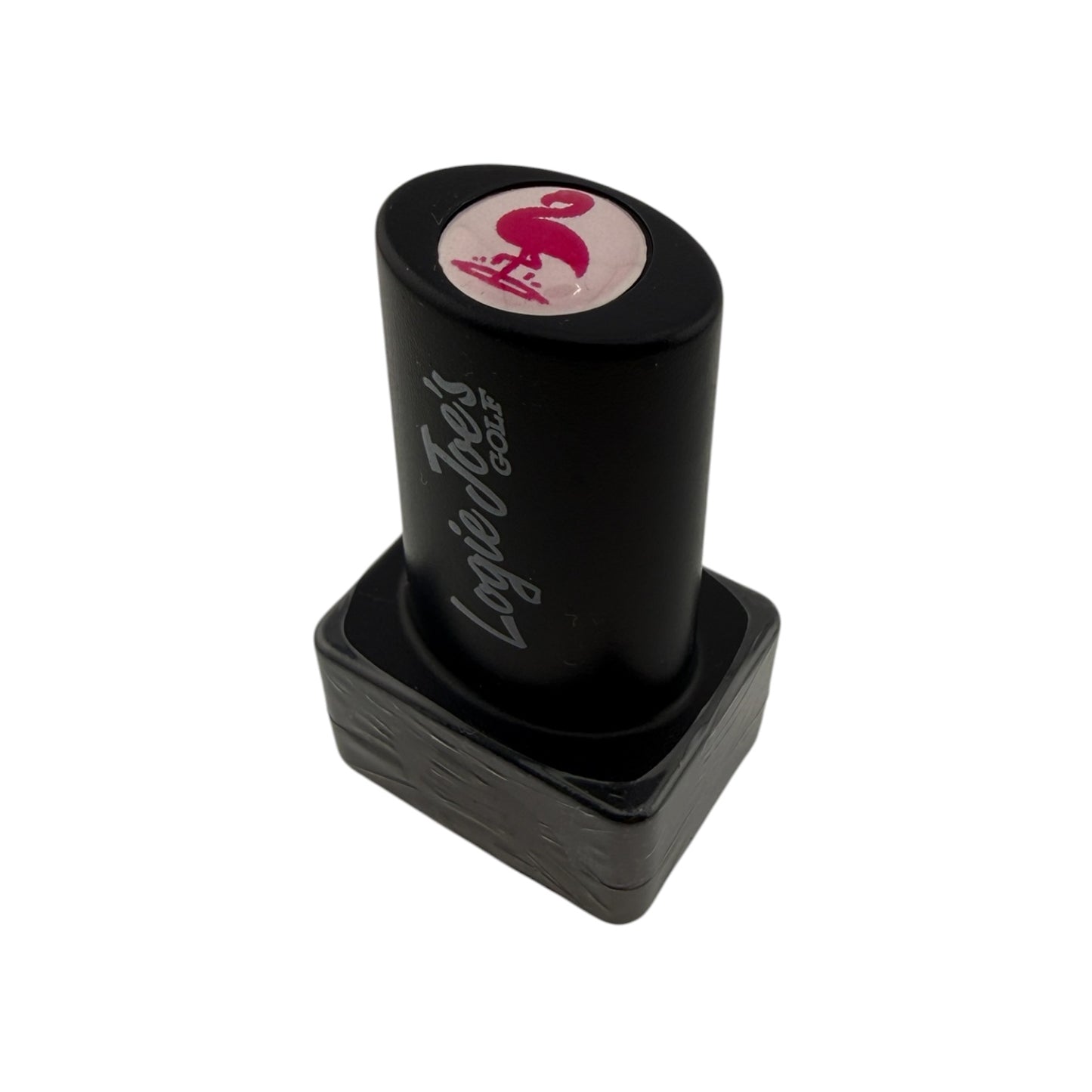 A self-inking Flamingo Golf Ball Stamp with quick-dry ink and a pink dollar sign on top, perfect for easy ball identification or as a fun golf gift. "Loyal Foxs Coils" is printed on the side. Shown on a white background.