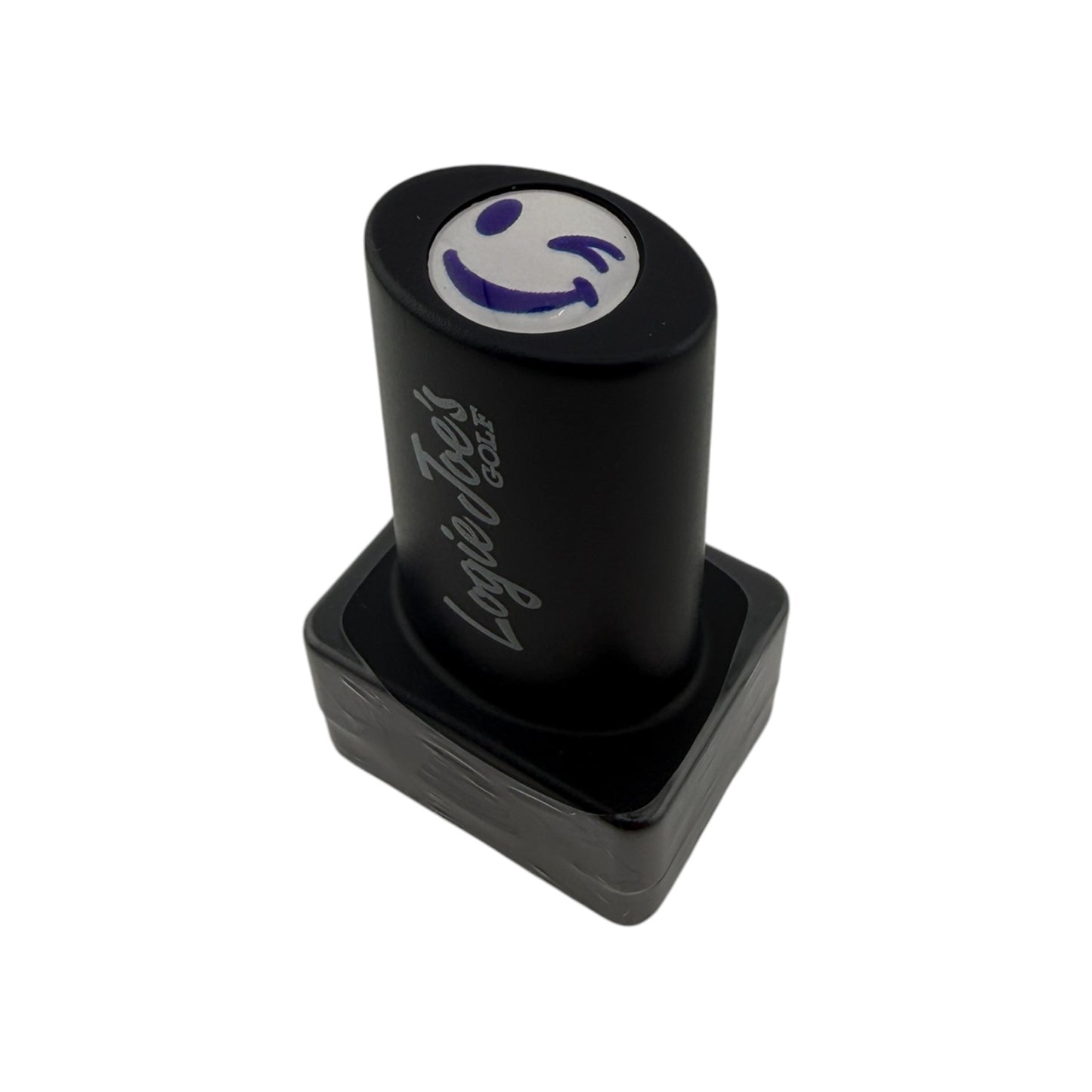 The Winky Face Golf Ball Stamp features quick-dry ink, easy ball identification, and a purple smiley face design—making it a fun golf gift, shown here with "Loyalty Test" on the black self-inking stamper against a white background.