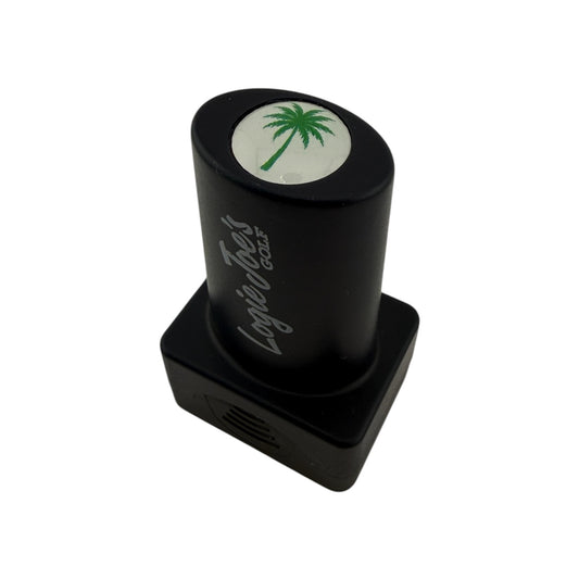 The Palm Tree Golf Ball Stamp features a green palm tree graphic and quick-dry ink for easy ball identification, making it a fun golf gift. Photographed on a white background.