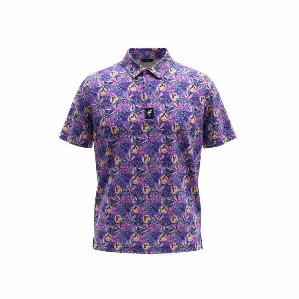 The Men's Purple Haze Golf Polo is a moisture-wicking, performance stretch shirt with short sleeves, a collar, and a bold tropical leaf and smiley face print in green, blue, and beige—perfect for standing out on the course.