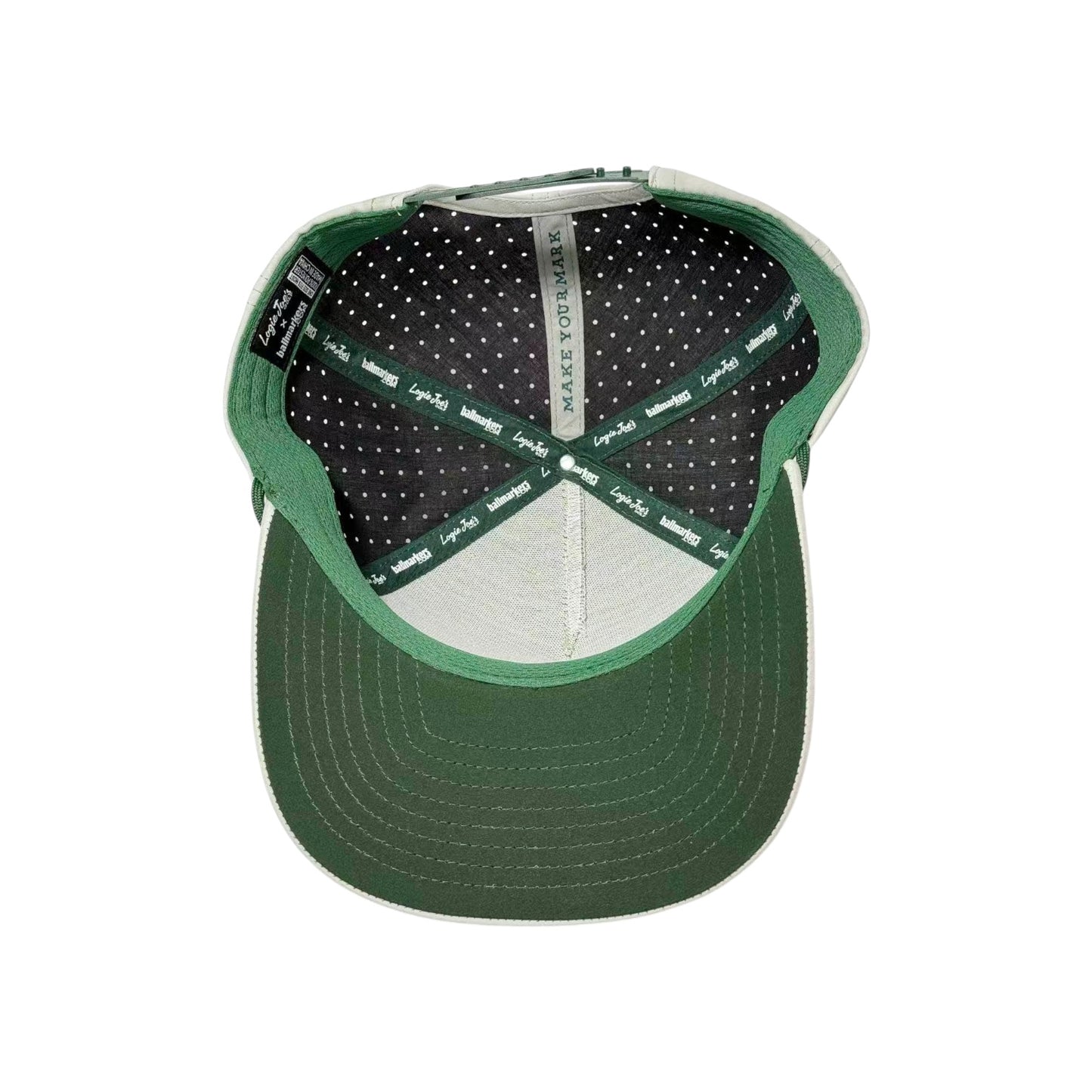 American Camo Tactical Golf Hat with adjustable snapback, built-in magnetic ball marker holder (marker included), “MAKE IT YOUR MARK” printed inside, black and gray polka dot lining, and green brim with white stitching.