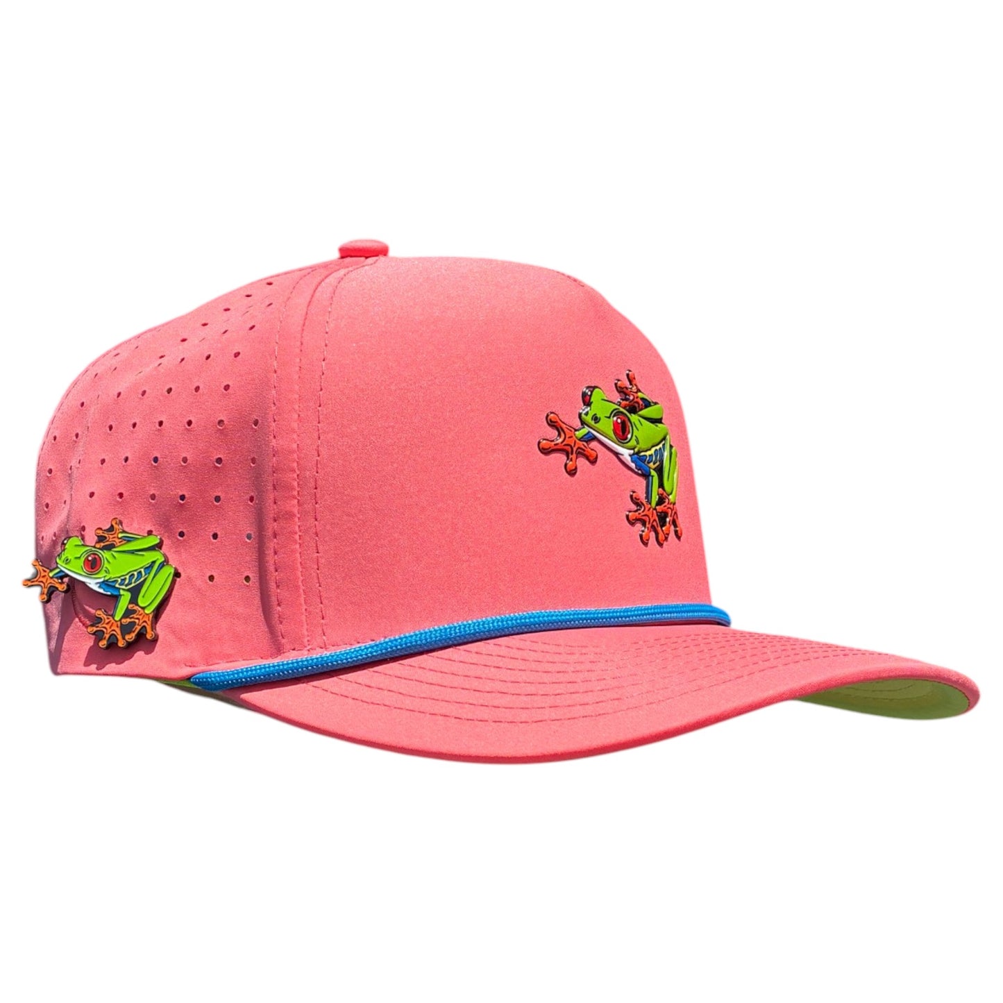 The Tree Frog Golf Hat is a bright pink snapback cap with two colorful tree frog designs, blue trim, built-in magnetic ball marker holder with marker included, small ventilation holes, and an adjustable fit.