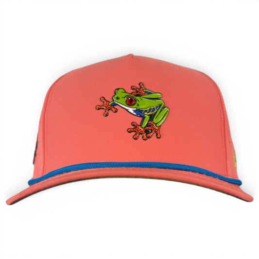 The Tree Frog Golf Hat is a snapback cap with a red-eyed tree frog patch, blue brim trim, yellow side logo, and an adjustable fit. It features a built-in magnetic ball marker holder with marker included—perfect for golfers.