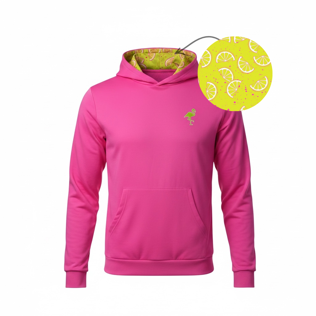 The Main Squeeze Performance Hoodie is a bright pink, lightweight, moisture-wicking unisex hoodie with a front pocket, green flamingo chest logo, and a yellow lemon-slice pattern with pink dots lining the hood for extra style.