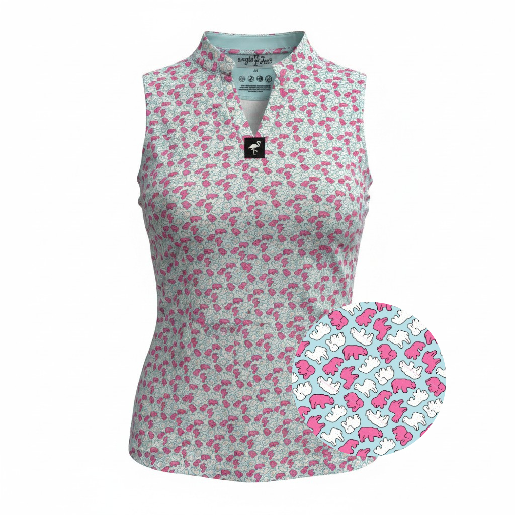 The Women's Frosted Animal Cookies Sleeveless Golf Polo features vibrant pink, white, and blue abstract shapes with whimsical dinosaur outlines. This moisture-wicking performance top blends playful style with sport-ready comfort.