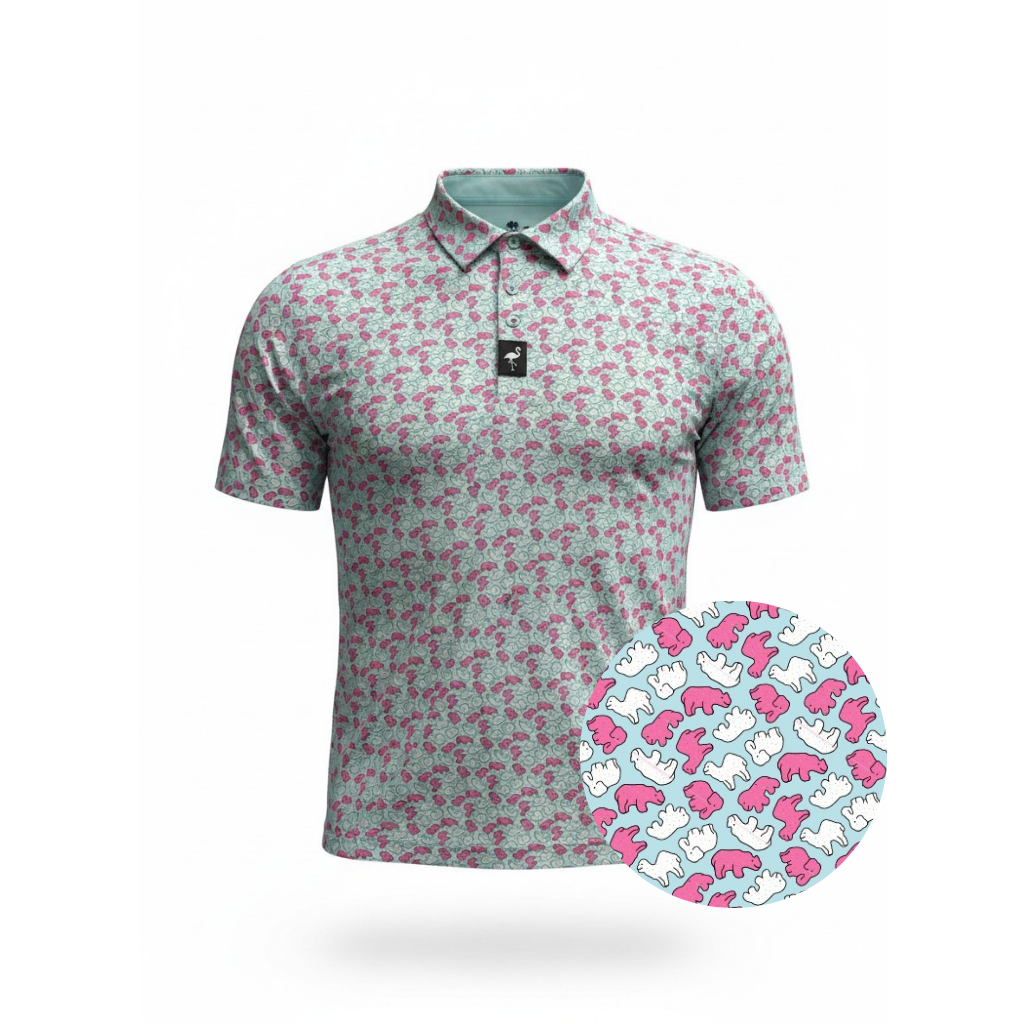 The Men's Frosted Animal Cookies Golf Polo features a pink, white, and blue abstract print with repeating dinosaur silhouettes. A circular zoom highlights the moisture-wicking fabric. Displayed on a plain white background.